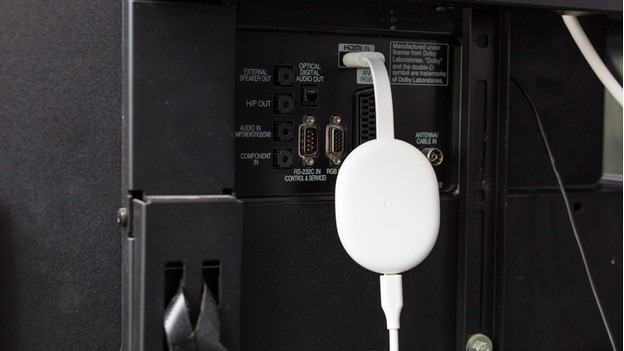 Google Chromecast plugged into a TV, ready for casting.