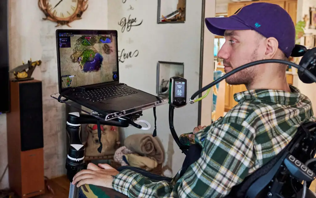 A disabled patient using brain-computer interface technology to control a computer.