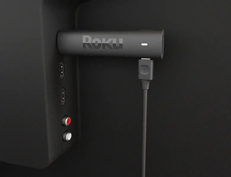 Roku Streaming Stick connected to a TV for seamless streaming.