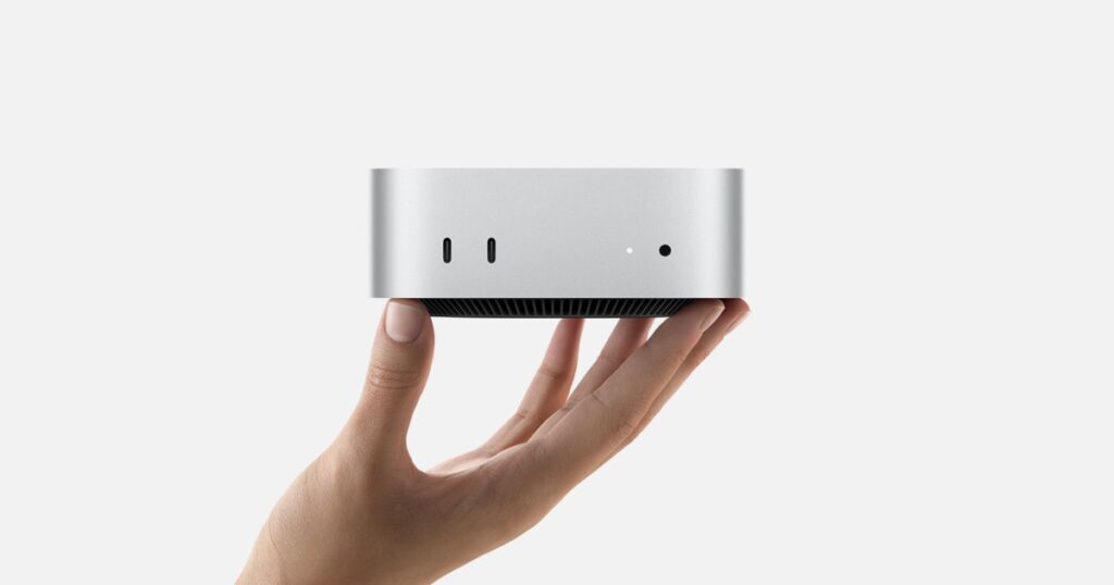 Apple Mac Mini M3 held with one hand