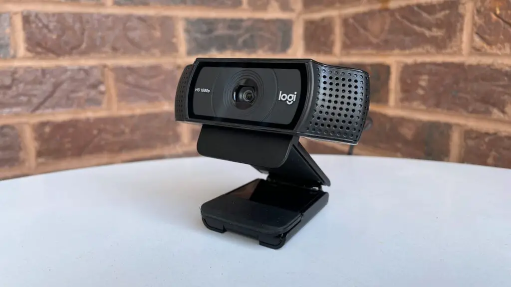 Logitech C920 webcam on table. 