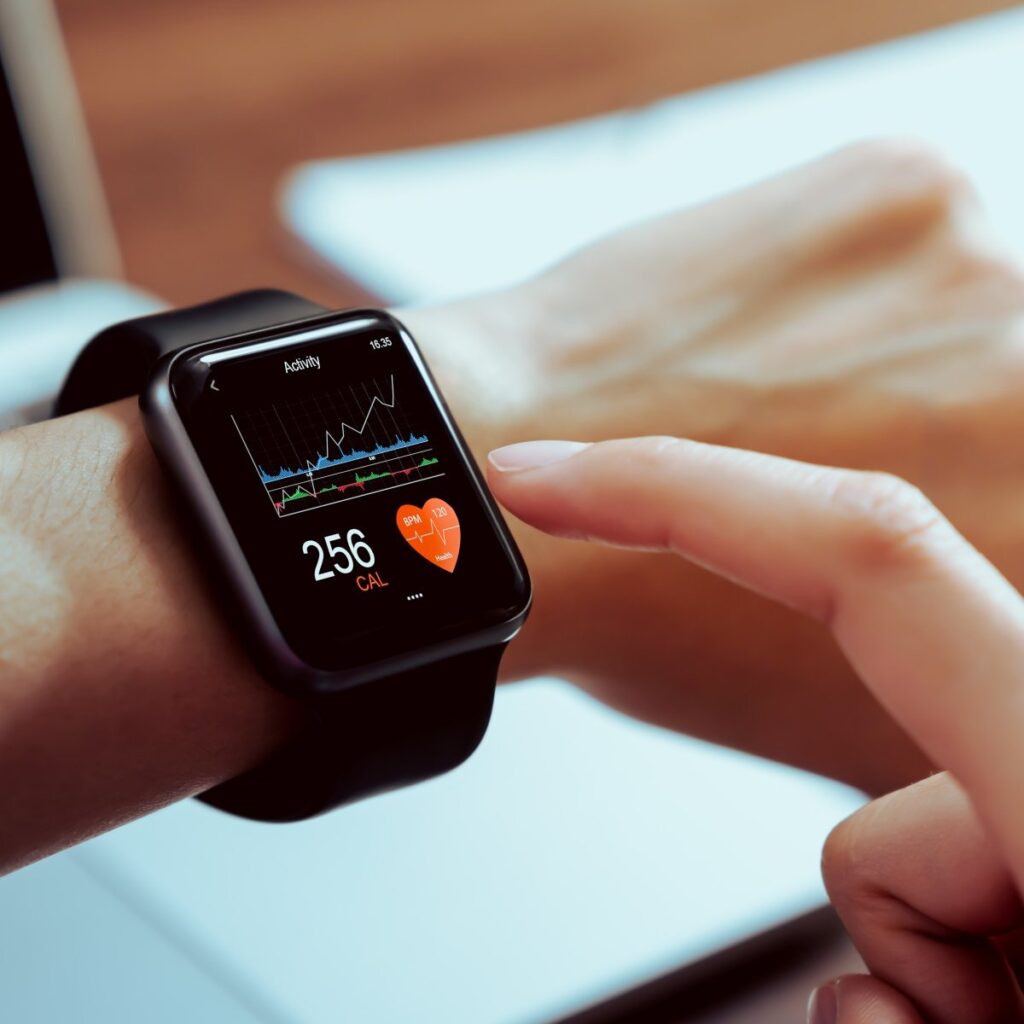 Smartwatch showing continuous blood heart rate monitoring.