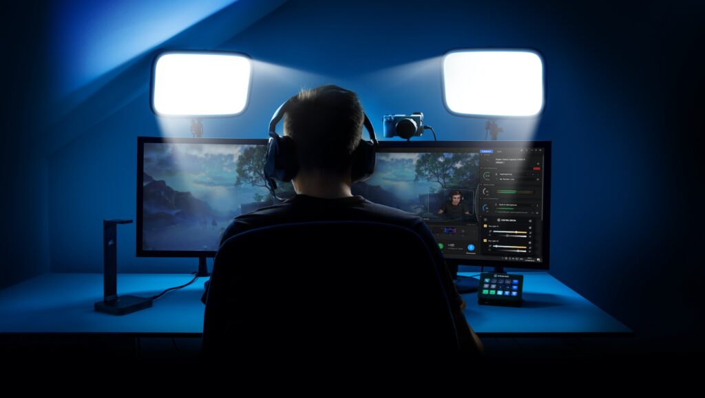 Streamer sitting with ring light and softbox lighting setup.
